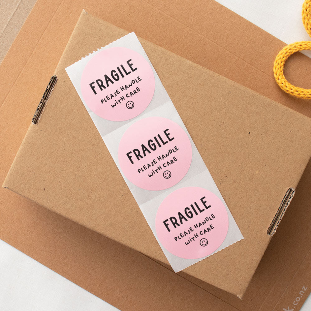 Fragile handle with care packaging sticker pink - At The Helm NZ