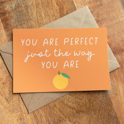 Orange positivity note card that reads "You are perfect just the way you are" features a orange fruit design - At The helm NZ