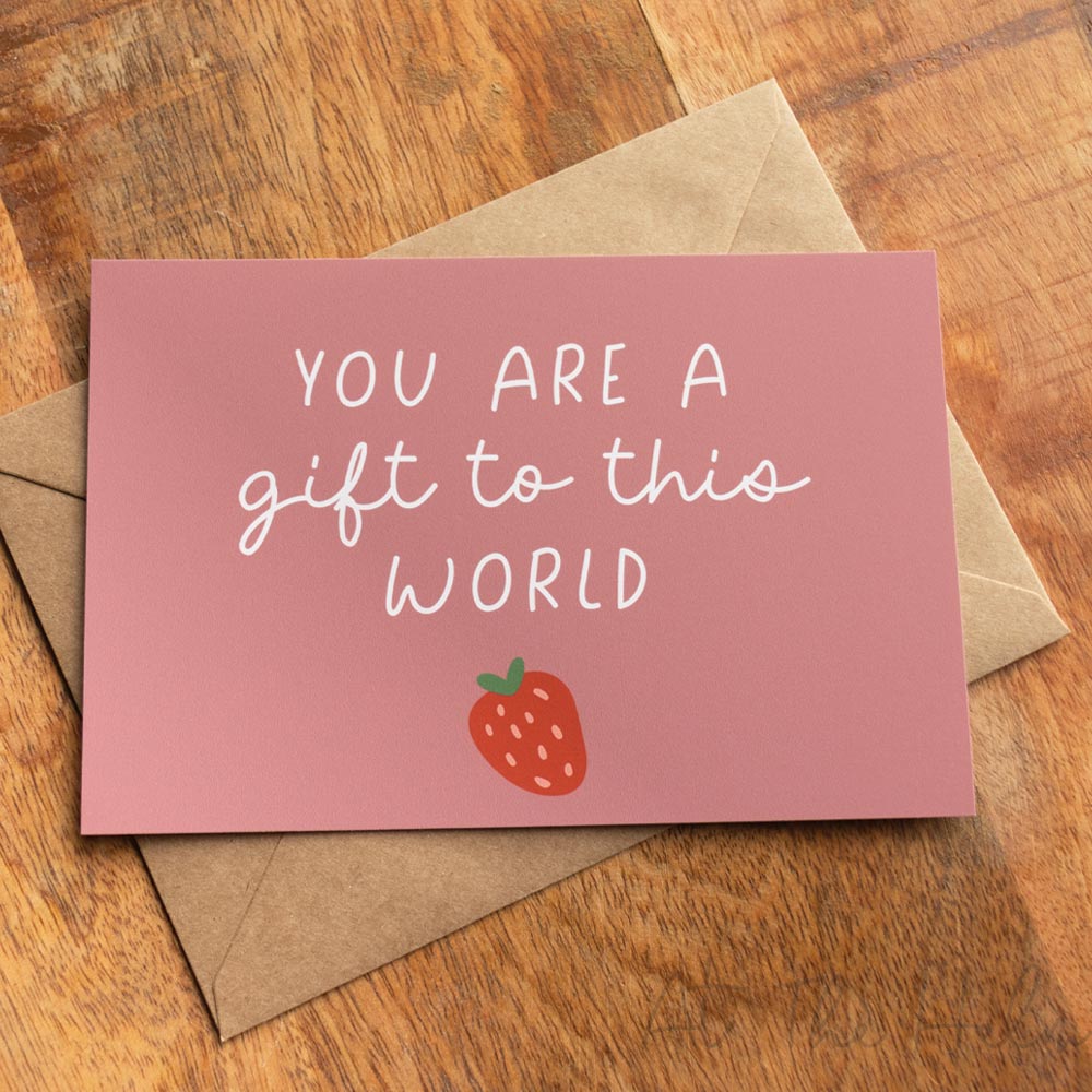 Pink  positivity note card that reads "You are a gift to this world" features a strawberry fruit design - At The helm NZ