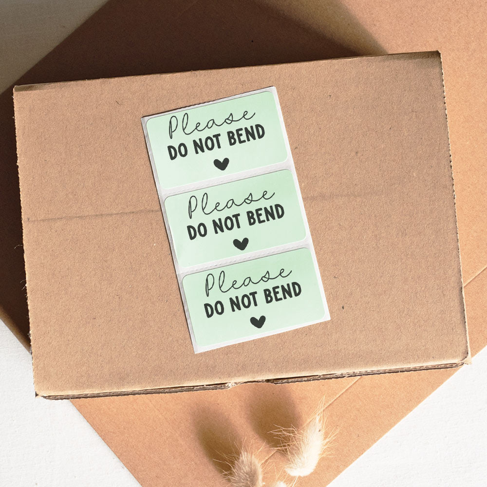 Please do not bend packaging stickers green with heart - At The Helm NZ