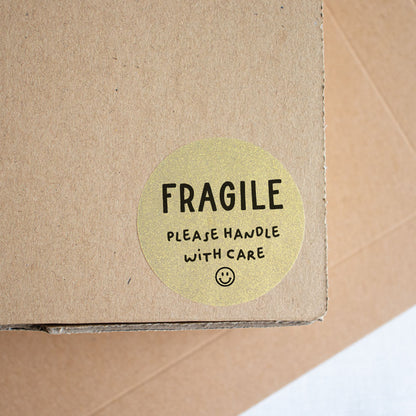 Fragile handle with care packaging sticker gold - At The Helm NZ